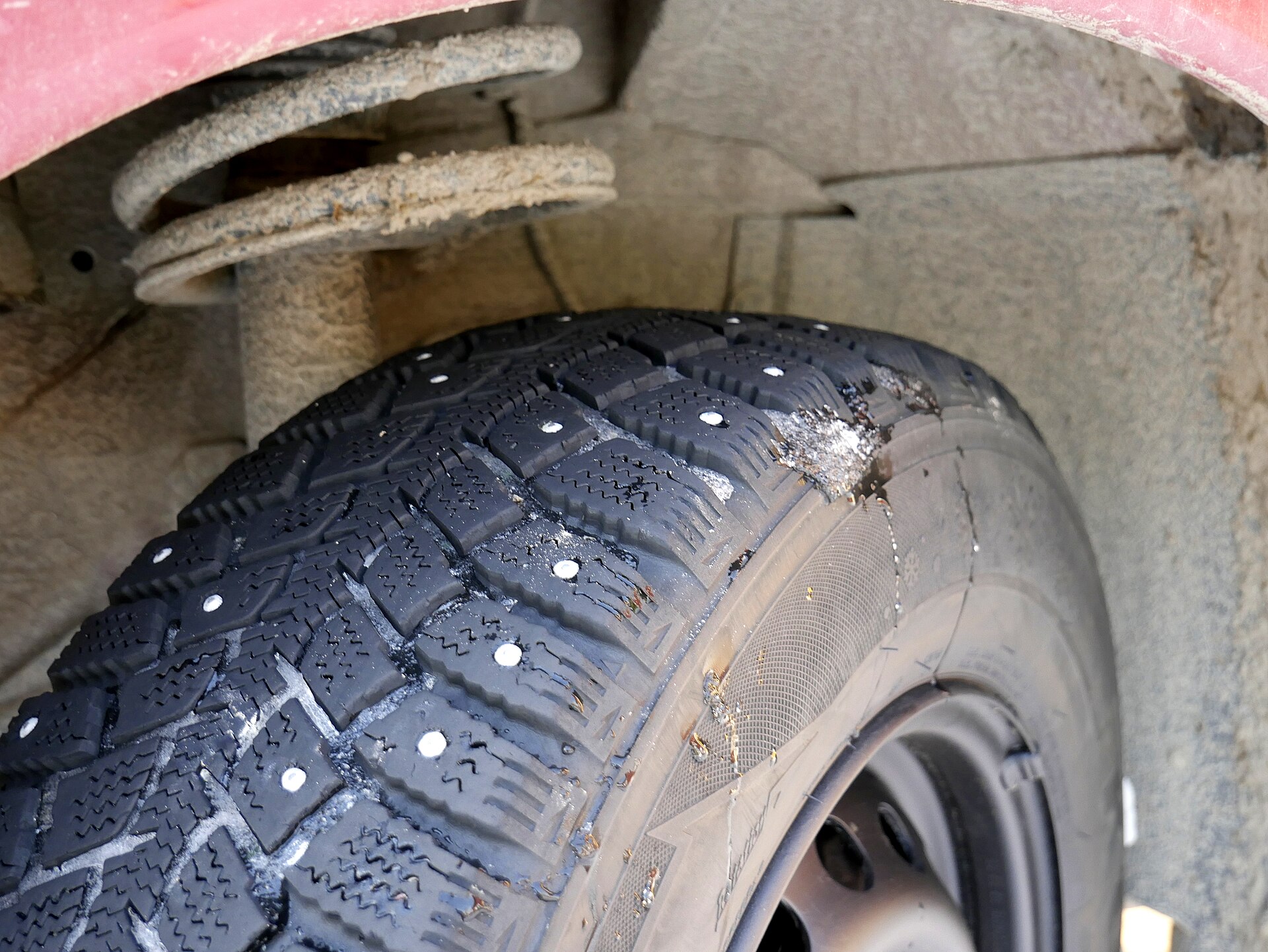 Close-up of a studded snow tire